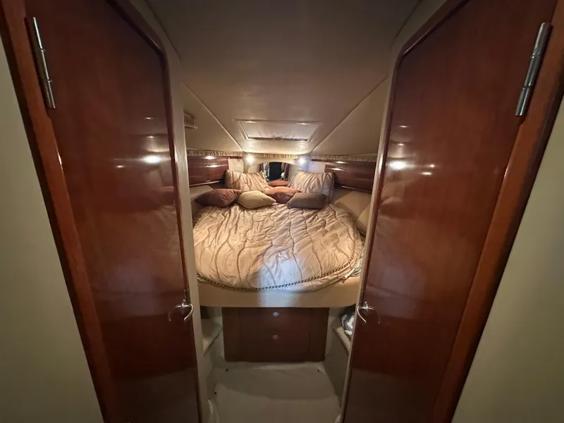 Slide: The Image of Luxurious cabin interior of 2005 Sea Ray 420 Sundancer yacht with cozy bedding. - 35