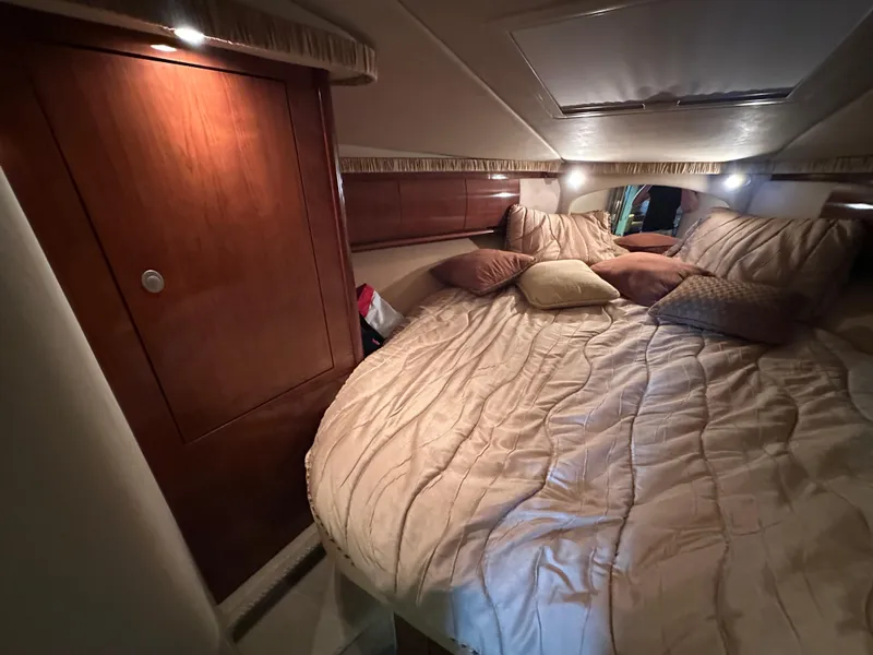 Slide: The Image of Luxurious cabin interior of 2005 Sea Ray 420 Sundancer yacht with cozy bedding. - 36