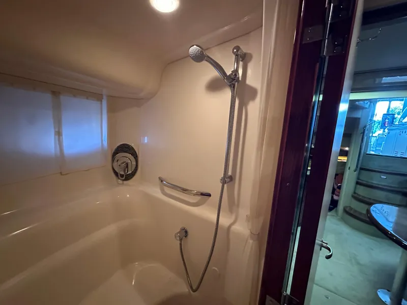 Slide: The Image of Bathroom interior of 2005 Sea Ray 420 Sundancer yacht, featuring shower and modern fixtures. - 40