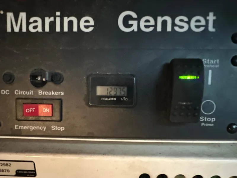 Slide: The Image of Control panel of a marine generator on a 2005 Sea Ray 420 Sundancer. - 42