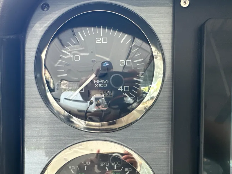 Slide: The Image of Close-up of 2005 Sea Ray 420 Sundancer RPM gauge showing 5952 hours. - 44