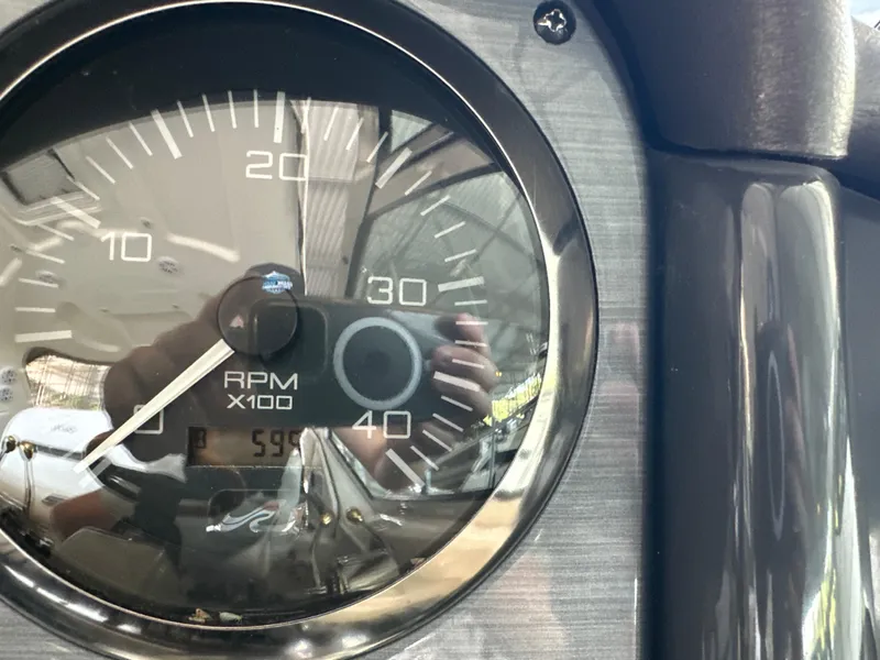 Slide: The Image of Close-up of 2005 Sea Ray 420 Sundancer RPM gauge showing 599 hours. - 45