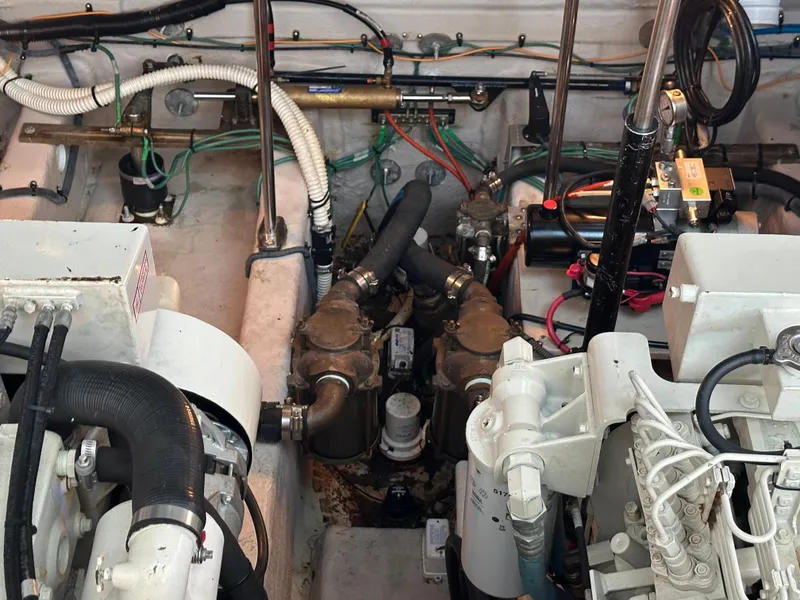 Slide: The Image of Engine room of a 2005 Sea Ray 420 Sundancer with visible mechanical components. - 46