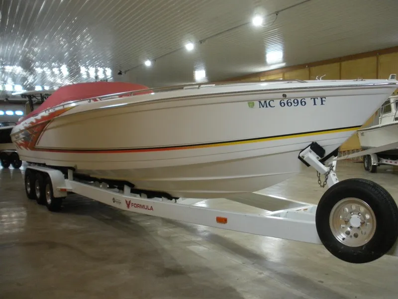 The Image of 2001 Fountain 35 Fastech boat on trailer in indoor storage facility. - 0