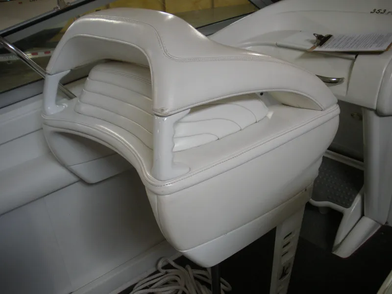 Slide: The Image of White leather seat in a 2001 Fountain 35 Fastech boat interior. - 11