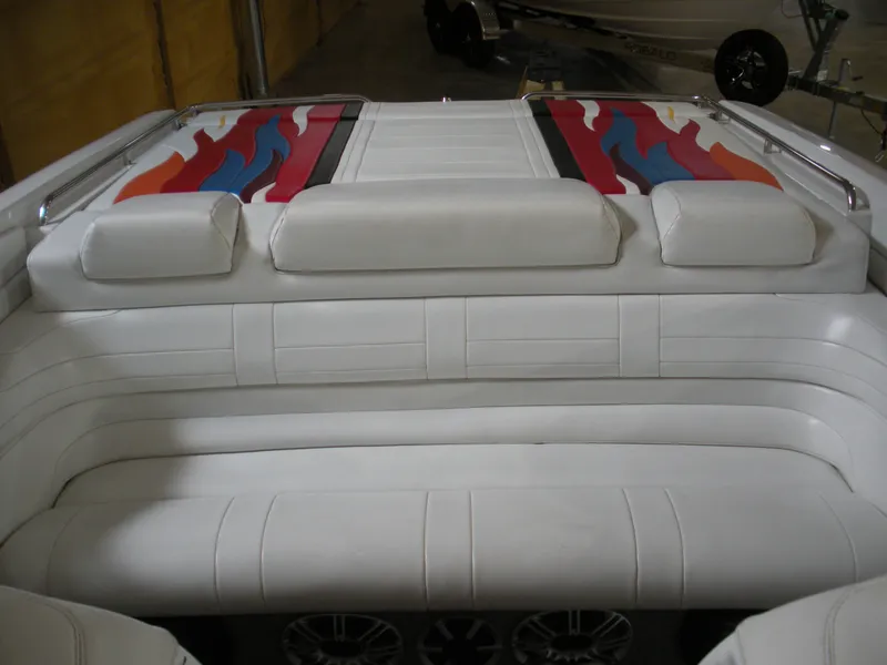 Slide: The Image of 2001 Fountain 35 Fastech boat interior with white seating and colorful flame design. - 12