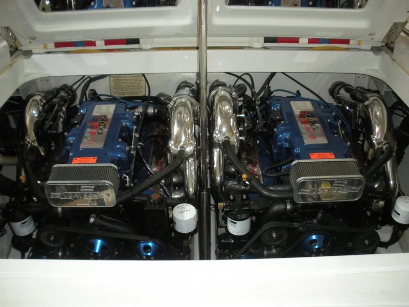 Slide: The Image of Twin engines in a 2001 Fountain 35 Fastech boat, showcasing powerful performance. - 16