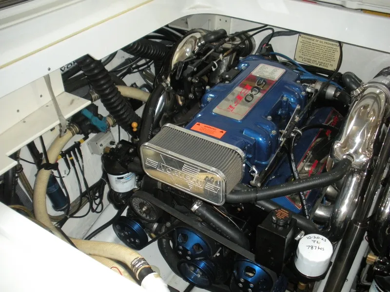 Slide: The Image of Engine compartment of a 2001 Fountain 35 Fastech boat, featuring a powerful Vortec engine. - 17