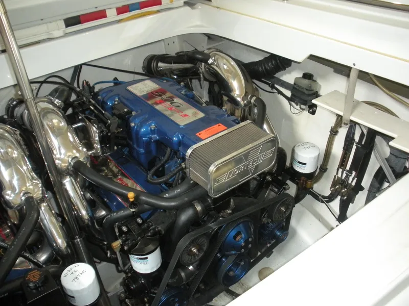 Slide: The Image of Engine compartment of a 2001 Fountain 35 Fastech boat, showcasing powerful machinery. - 18