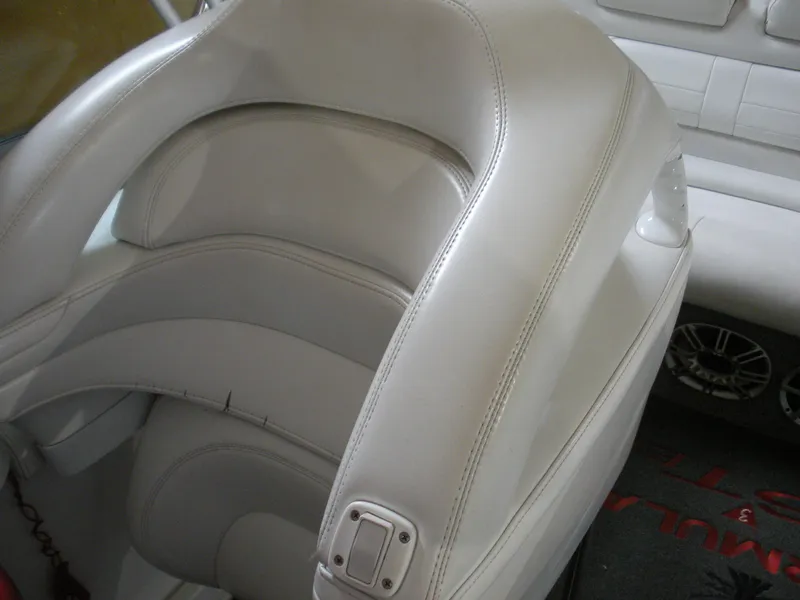 Slide: The Image of 2001 Fountain 35 Fastech boat interior with white leather seating and speaker detail. - 9