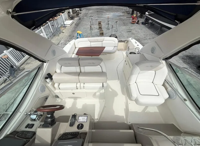 Slide: The Image of 2011 Sea Ray 350 Sundancer boat interior with seating and control panel. - 14