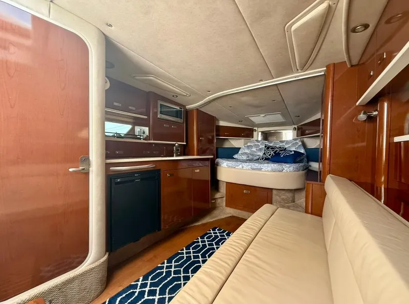 Slide: The Image of Interior of 2011 Sea Ray 350 Sundancer yacht with cozy cabin and modern amenities. - 15