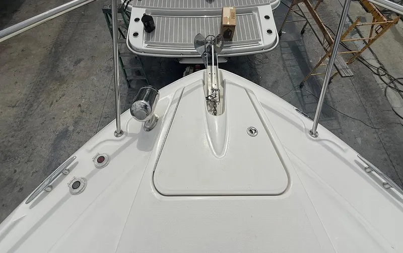 Slide: The Image of 2011 Sea Ray 350 Sundancer boat deck with anchor and railing. - 24