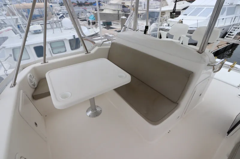 Slide: The Image of The image shows the seating area on the flybridge deck of a 2001 Riviera 43 Open Flybridge. - 22
