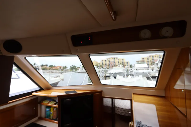 Slide: The Image of Interior view of the 2001 Riviera 43 Open Flybridge, overlooking the marina. - 30