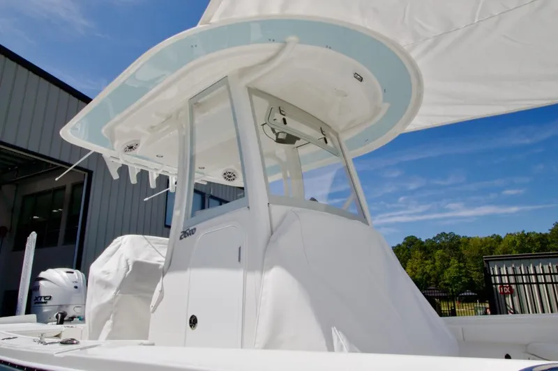 Slide: The Image of 2026 Regulator 26XO boat interior with white seating and Yamaha XTO outboard engine. - 12