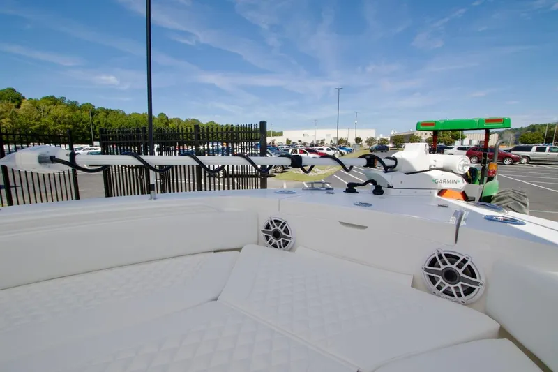 Slide: The Image of 2026 Regulator 26XO boat interior with rod holders and livewell. - 18