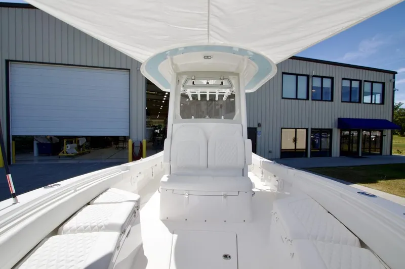 Slide: The Image of 2026 Regulator 26XO boat interior with white seating and Yamaha XTO engine. - 19
