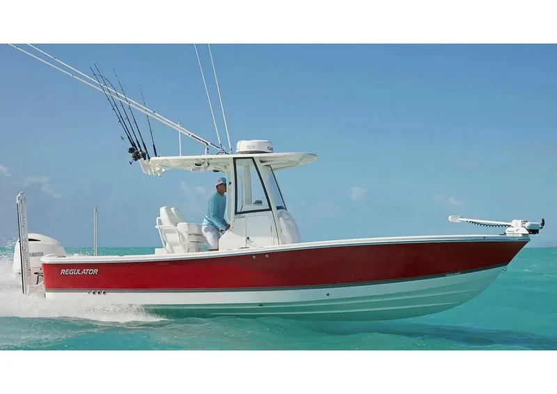 Slide: The Image of 2026 Regulator 26XO boat with T-top, docked under clear blue sky. - 2