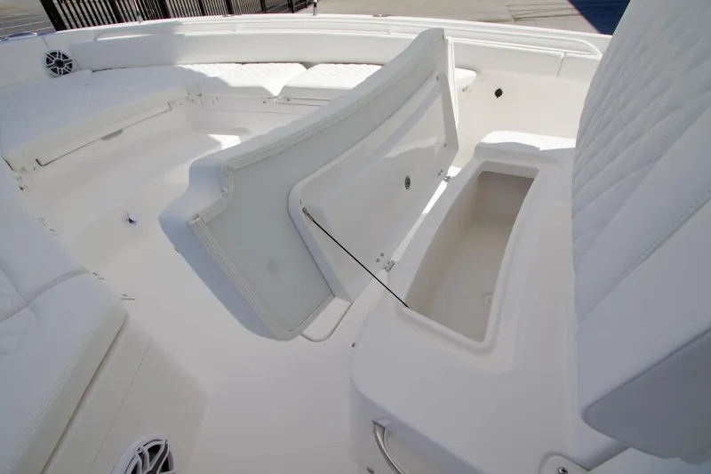Slide: The Image of 2026 Regulator 26XO boat deck with storage compartments and motor. - 20