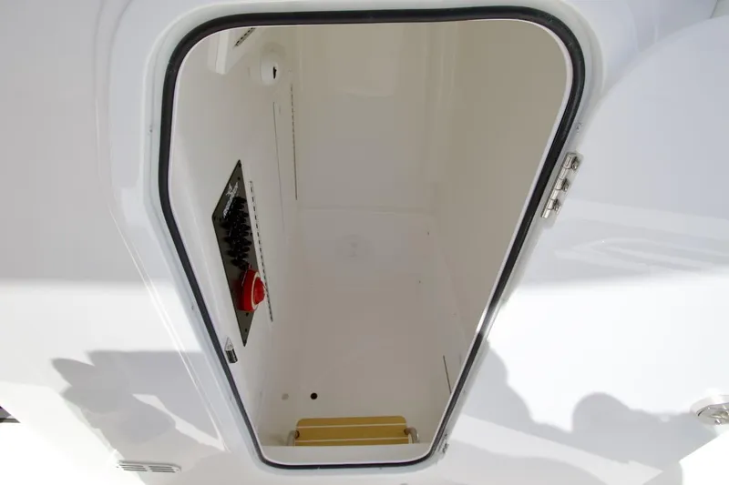 Slide: The Image of 2026 Regulator 26XO boat detail with fuel cap and warning sticker. - 24