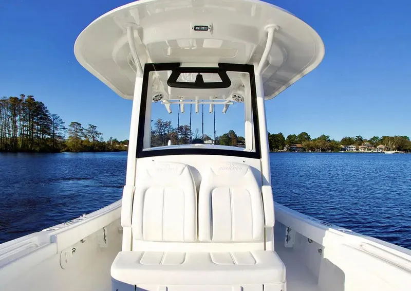 Slide: The Image of 2026 Regulator 26XO boat interior with covered console and Yamaha XTO engine. - 6