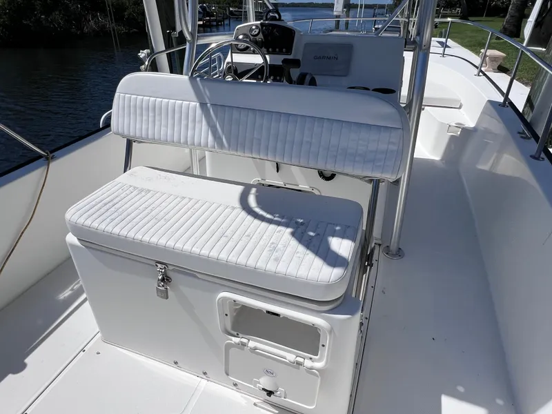 Slide: The Image of 2016 Boston Whaler 210 Montauk boat interior with seating and console. - 13