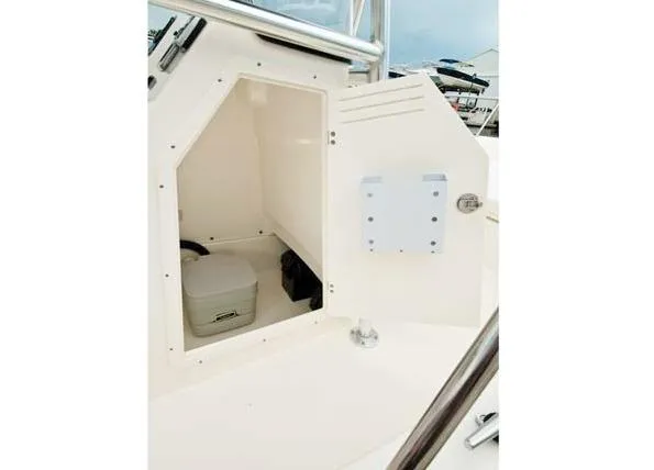 Slide: The Image of Manufacturer Provided Image: 2016 Boston Whaler 210 Montauk storage compartment with portable toilet. - 15