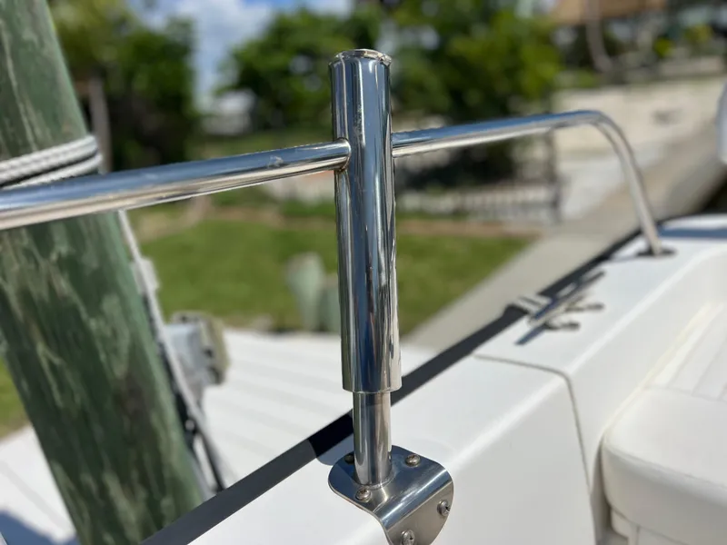 Slide: The Image of Close-up of a 2016 Boston Whaler 210 Montauk's stainless steel railing on a sunny day. - 17