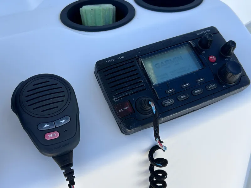 Slide: The Image of VHF radio and microphone on 2016 Boston Whaler 210 Montauk boat console. - 22