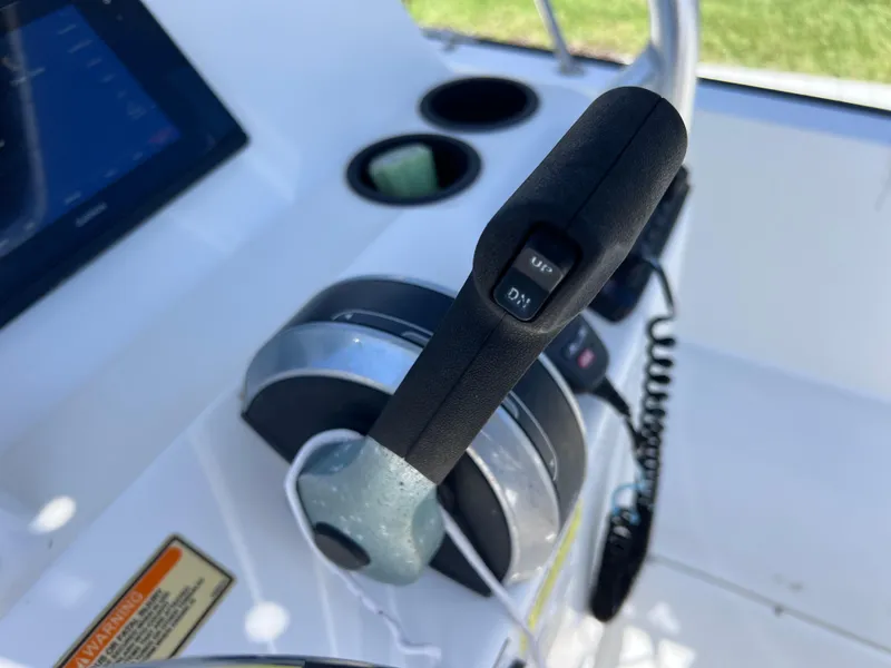 Slide: The Image of Throttle control on a 2016 Boston Whaler 210 Montauk boat dashboard. - 27