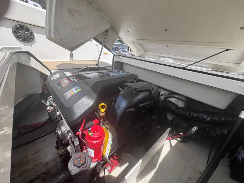 Slide: The Image of Engine compartment of a 2013 Cobalt 24SD boat, showcasing detailed mechanical components. - 15