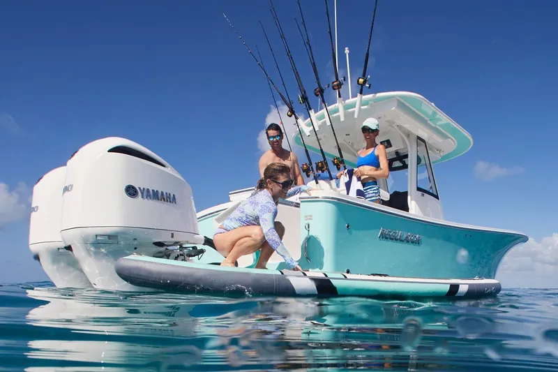 Slide: The Image of 2026 Regulator 28 boat on trailer, aerial view, parked on asphalt. - 6