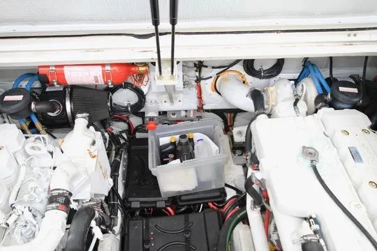 Slide: The Image of Engine compartment of a 2006 Harbor Master Coastal 400 with visible components and fire extinguisher. - 15