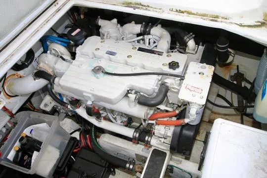 Slide: The Image of Engine compartment of a 2006 Harbor Master Coastal 400 boat, showcasing mechanical components. - 18