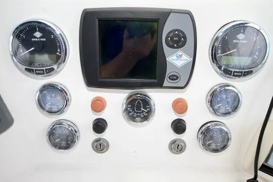 Slide: The Image of Control panel of a 2006 Harbor Master Coastal 400 boat with gauges and display. - 27