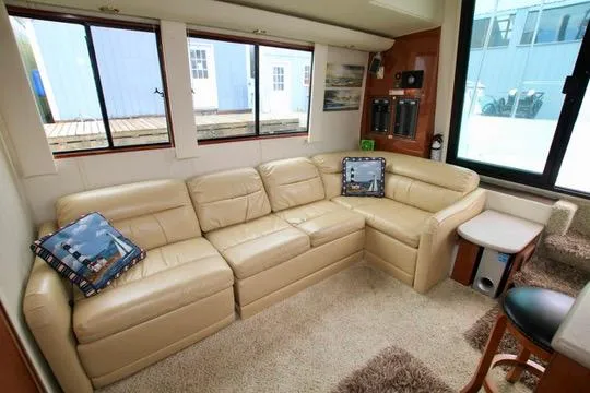 Slide: The Image of Luxurious interior of 2006 Harbor Master Coastal 400 yacht with beige leather seating. - 34