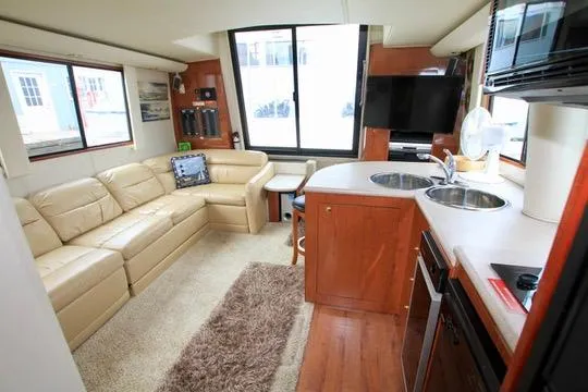Slide: The Image of Luxurious 2006 Harbor Master Coastal 400 yacht interior with modern kitchen and cozy seating area. - 38