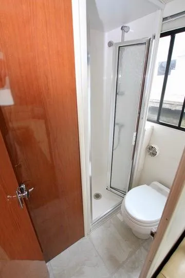 Slide: The Image of Compact bathroom with shower and toilet in 2006 Harbor Master Coastal 400 boat. - 43