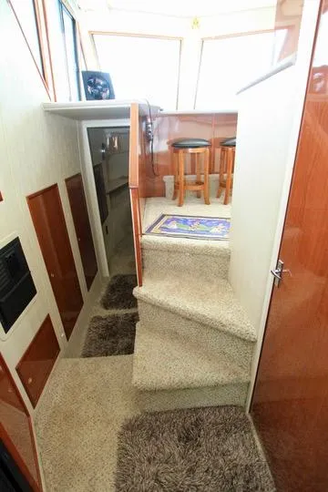 Slide: The Image of Interior of 2006 Harbor Master Coastal 400 yacht with carpeted stairs and wooden accents. - 47