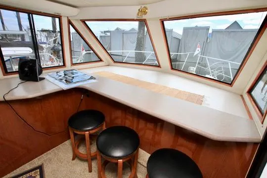Slide: The Image of Interior of 2006 Harbor Master Coastal 400 with panoramic windows and seating area. - 48