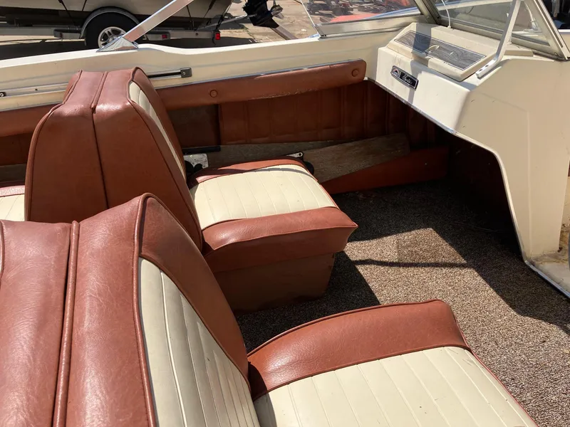 Slide: The Image of 1976 Glastron 156 Open Bow interior with brown and cream seats. - 8