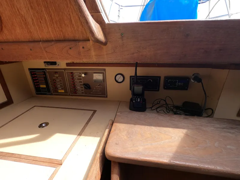 Slide: The Image of Control panel and radio equipment inside a 1984 CAL 31 sailboat cabin. - 11