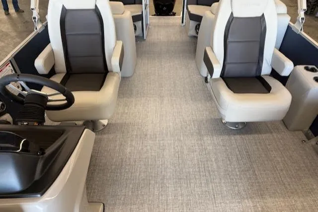 Slide: The Image of 2025 Harris Cruiser 230 CWDH interior with modern seating and steering wheel. - 12