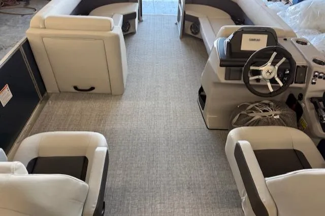 Slide: The Image of 2025 Harris Cruiser 230 CWDH interior with plush seating and modern steering console. - 15