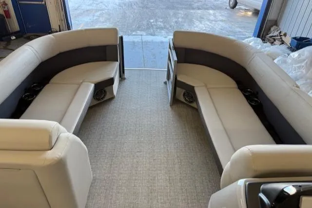 Slide: The Image of 2025 Harris Cruiser 230 CWDH interior with spacious seating and modern design. - 17