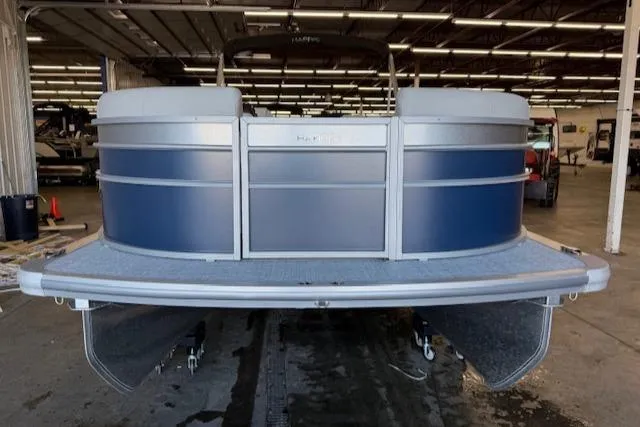 Slide: The Image of 2025 Harris Cruiser 230 CWDH pontoon boat in a warehouse setting. - 3