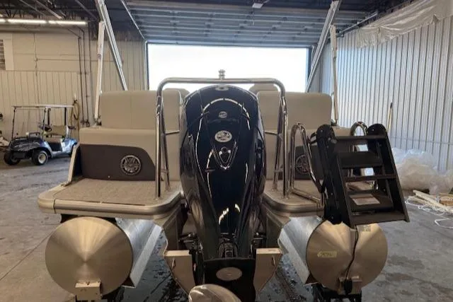 Slide: The Image of 2025 Harris Cruiser 230 CWDH pontoon boat in a warehouse setting. - 7