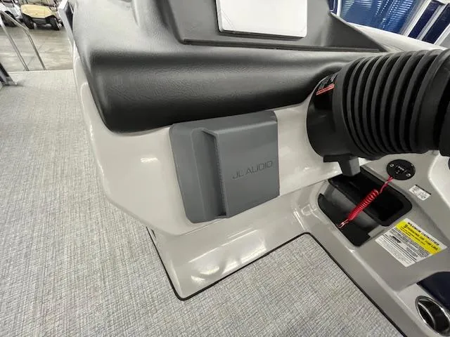 Slide: The Image of 2025 Harris Cruiser 210 boat dashboard featuring JL Audio system and control panel. - 10