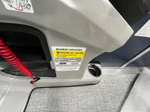 Slide: The Image of 2025 Harris Cruiser 210 boat capacity label, showing maximum of 9 persons or 1198 lbs. - 12